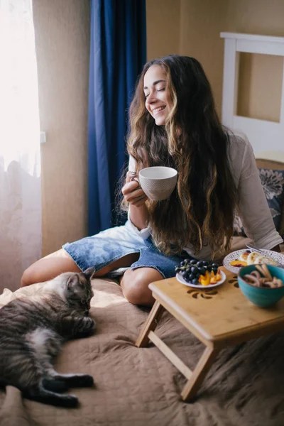 depositphotos_302725170-stock-photo-portrait-young-beautiful-woman-cup