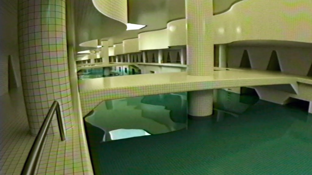 Interior view of a modern swimming pool area featuring white tiled columns and unique architectural shapes, with clear blue water reflecting the lighting.